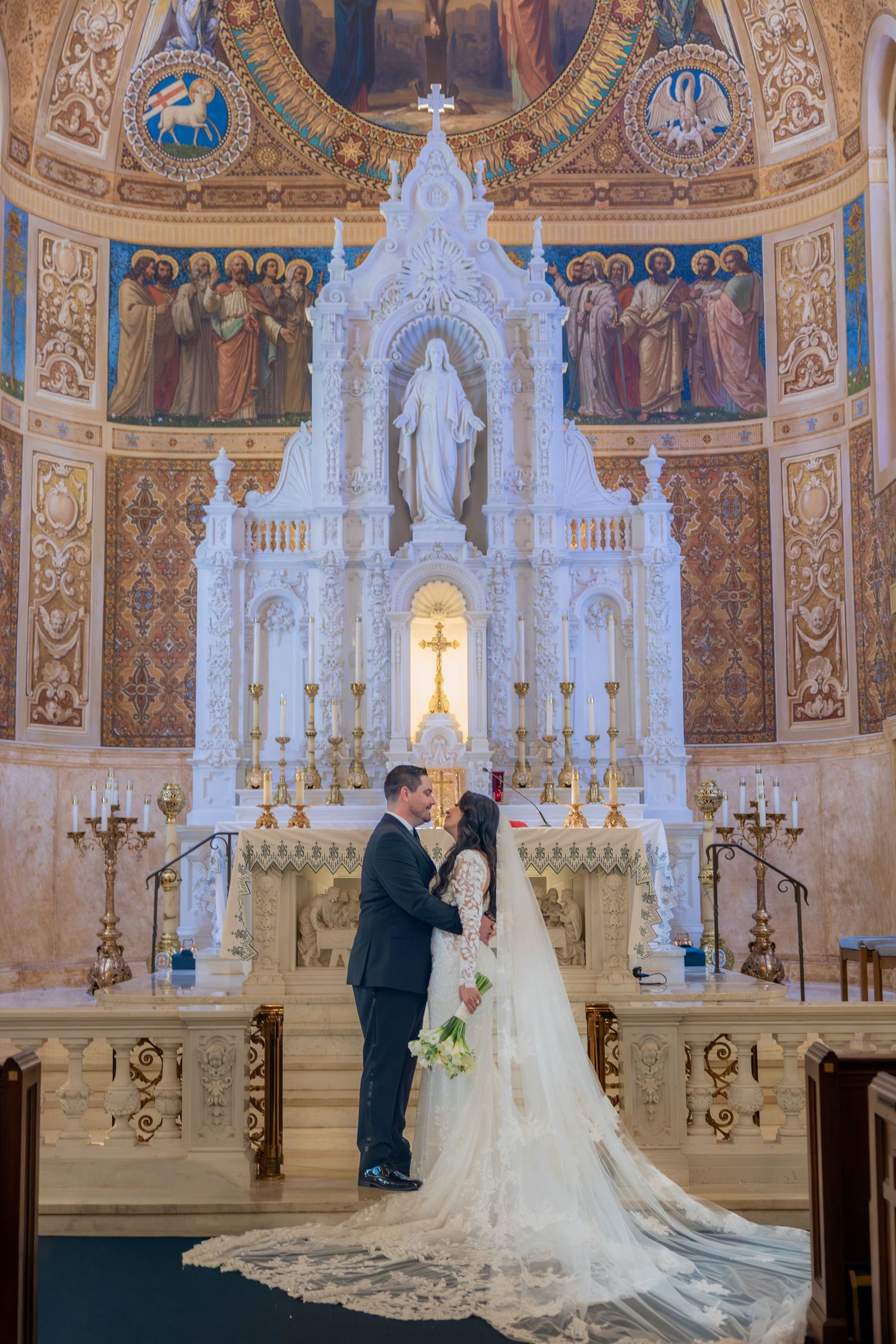 bride and groom at st. Edwards basilica in palm beach florida