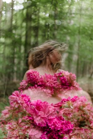 A dreamy series of portraits showing someone behind vibrant pink carnations in a forest setting with soft bokeh effect.
