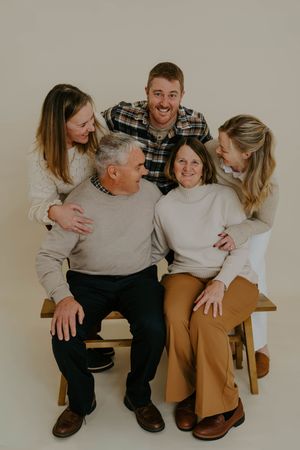 Candid moments of a family photo session showing natural interactions and laughter.