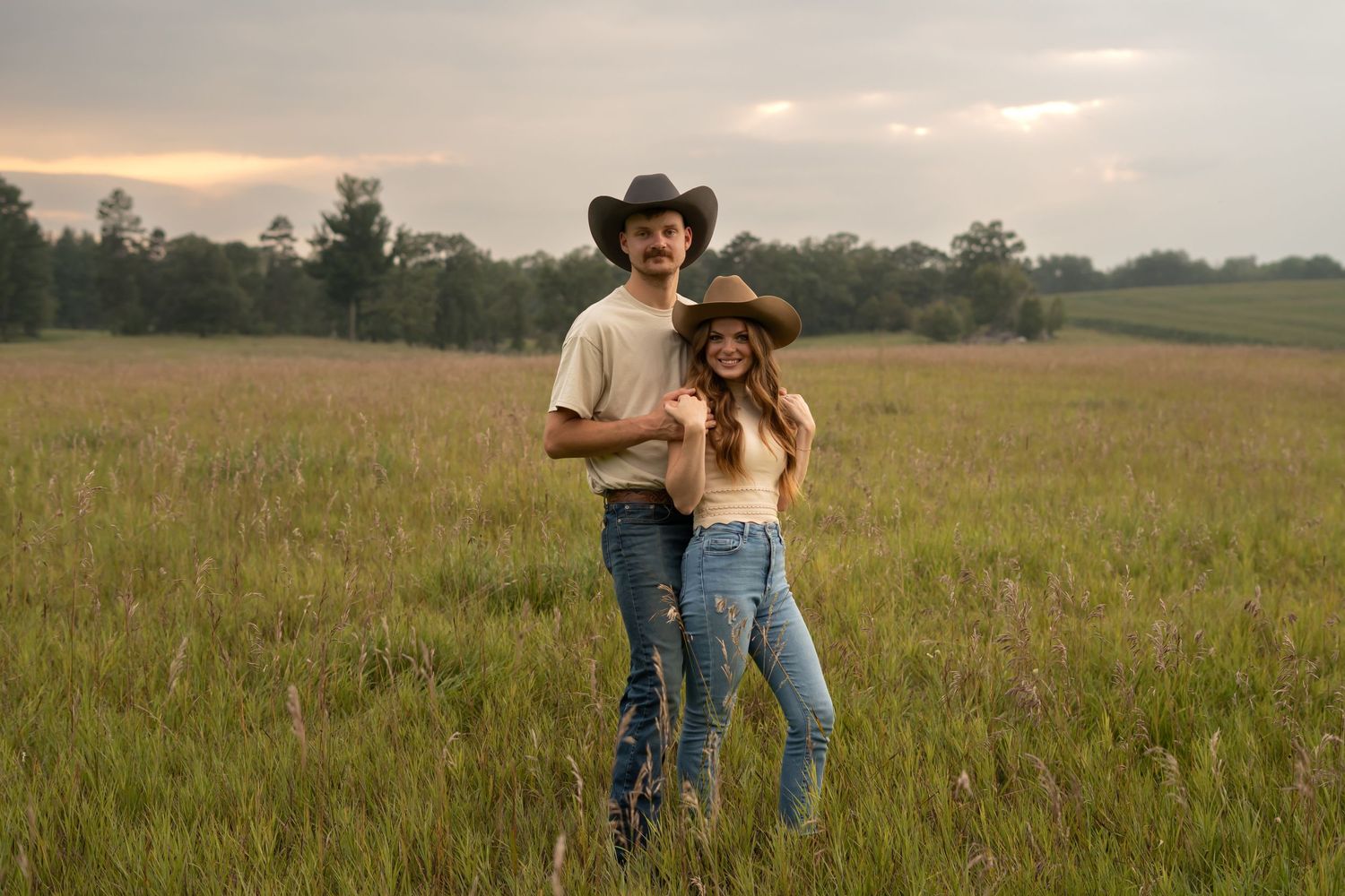 Engagement photos of a country couple in a hayfield in Pillager, Minnesota.