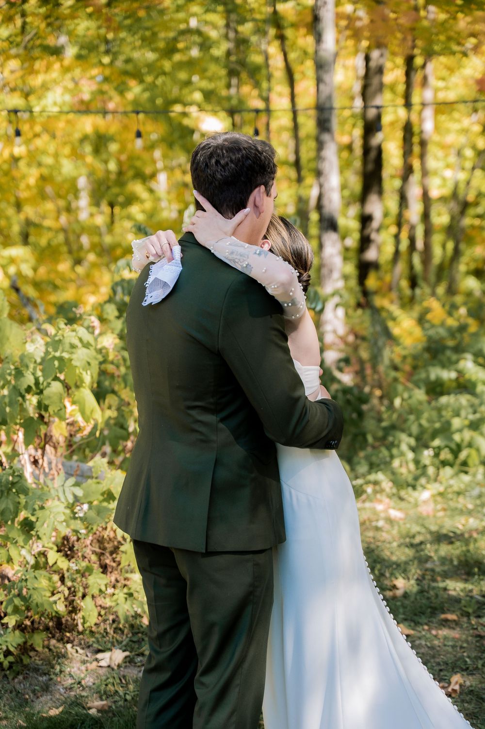 A romantic wedding moment captured in sequence against a backdrop of autumn trees.