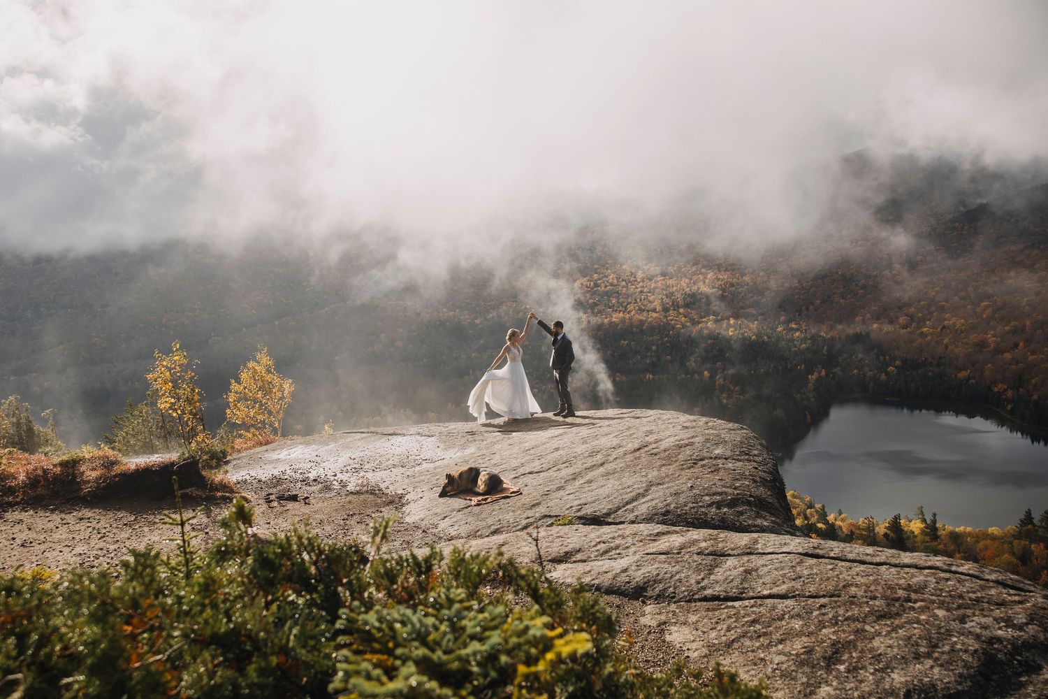couple eloping in the adirondack mountains during fall with heart lake and mountain views