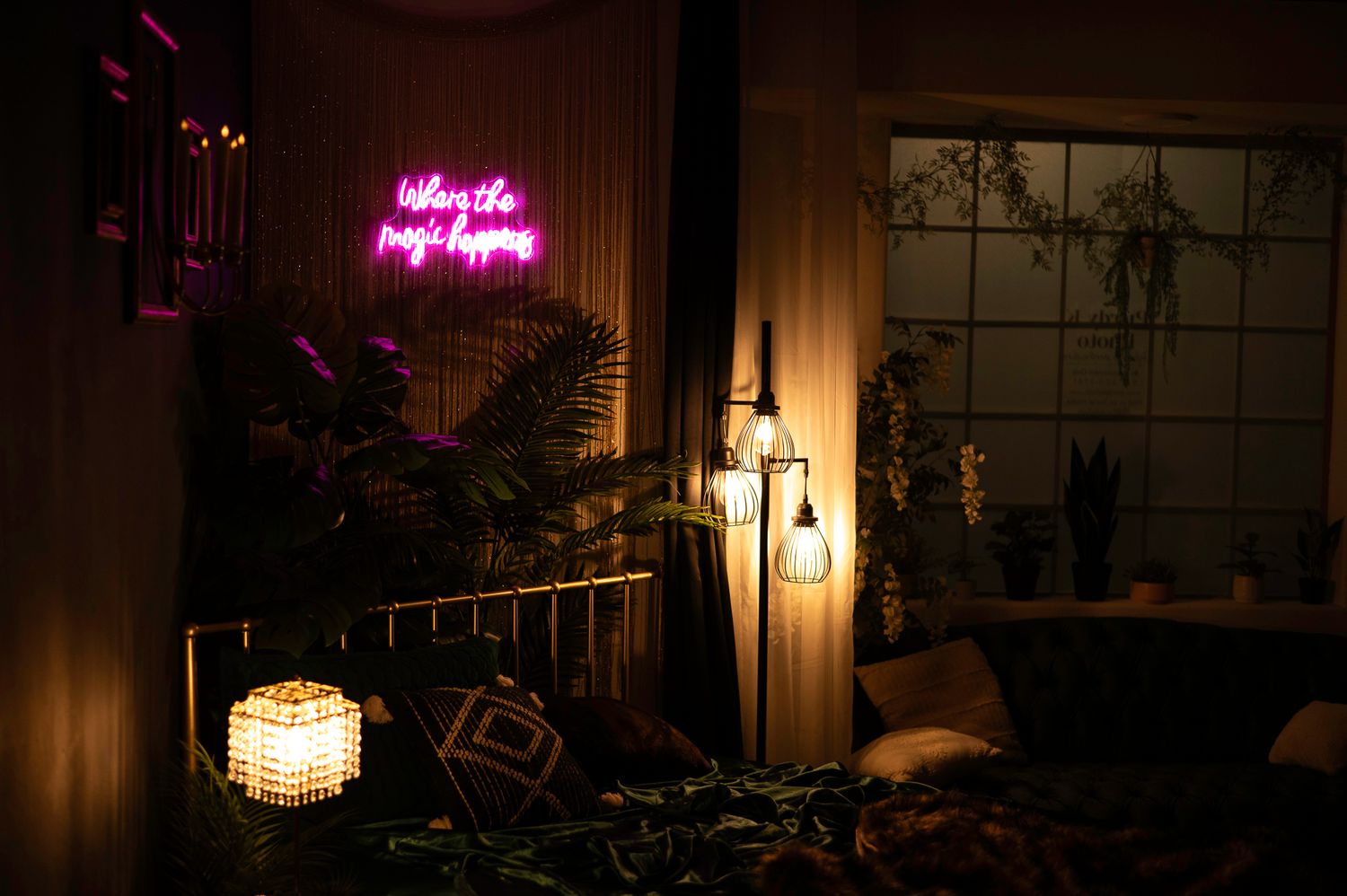 Moody interior room with glowing pink neon sign and vintage chandelier lighting creating atmospheric ambiance.