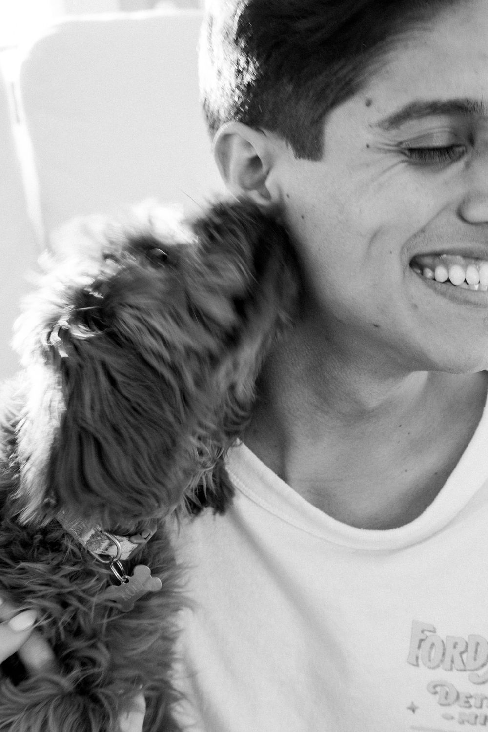 dog licking mans ear