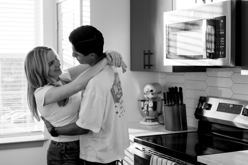 couple hugging in kitchen
