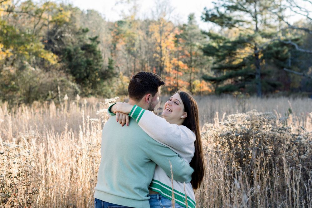 couple hugging in field