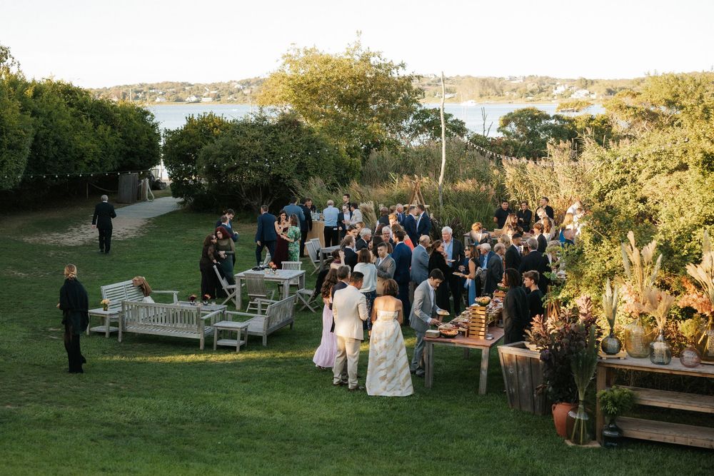 Guests gather for cocktail hour on the lawn