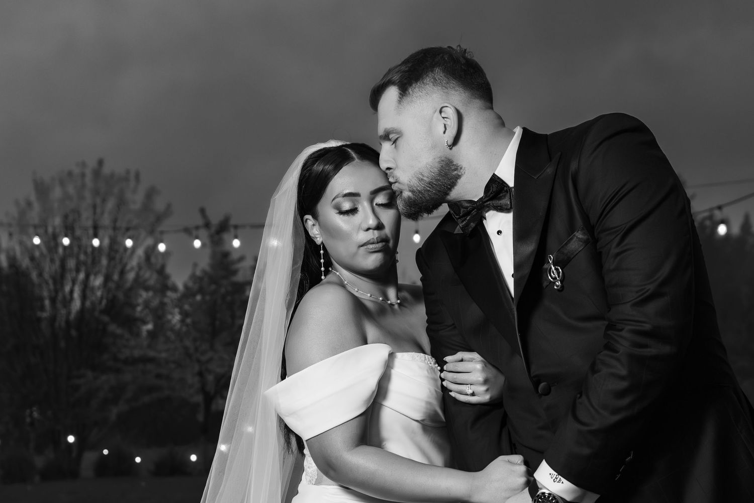 A romantic black and white wedding photo collage showing tender moments between a couple on their special day.