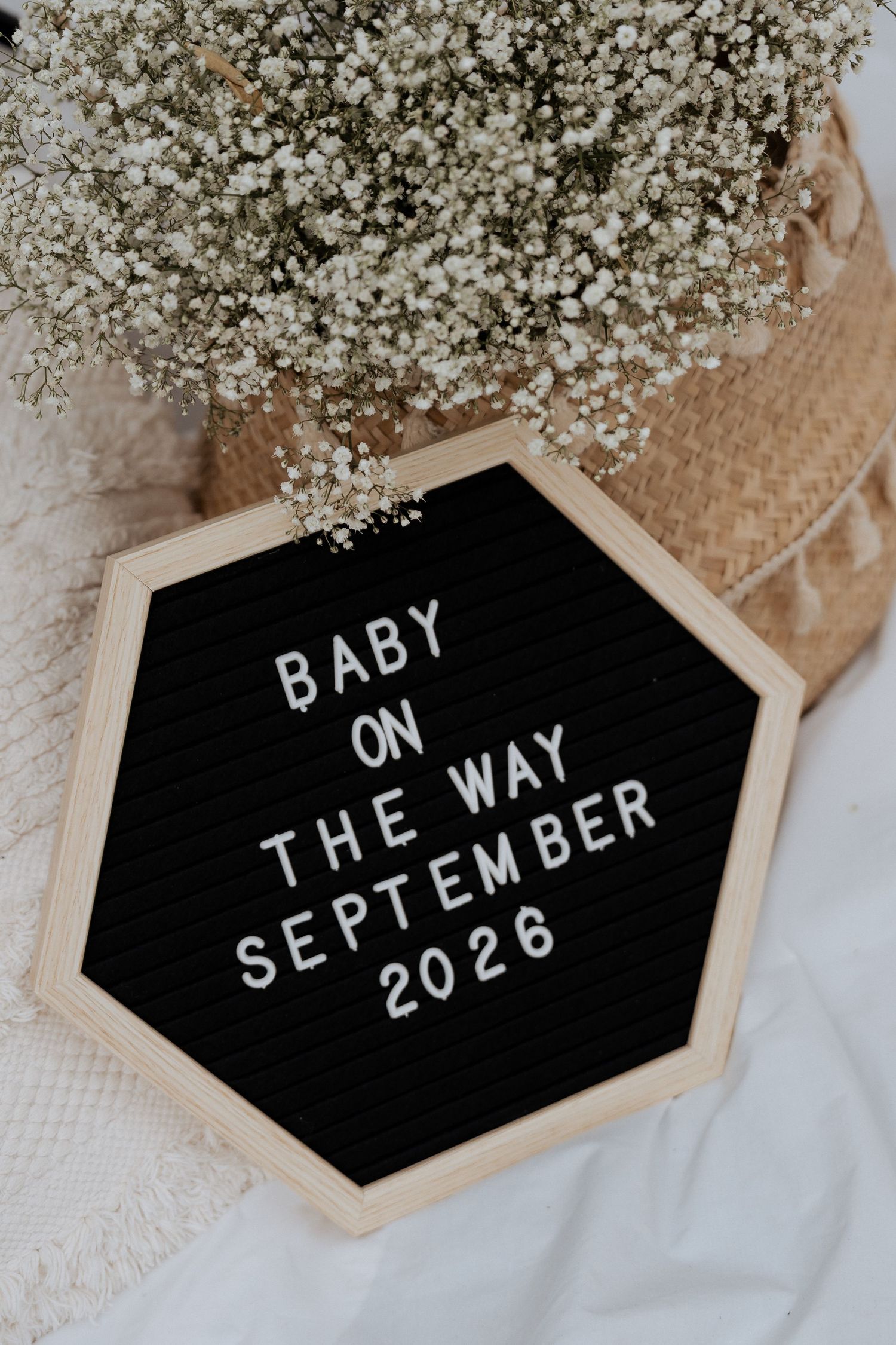 Pregnancy announcement board detail baby arriving September maternity photoshoot Dubai