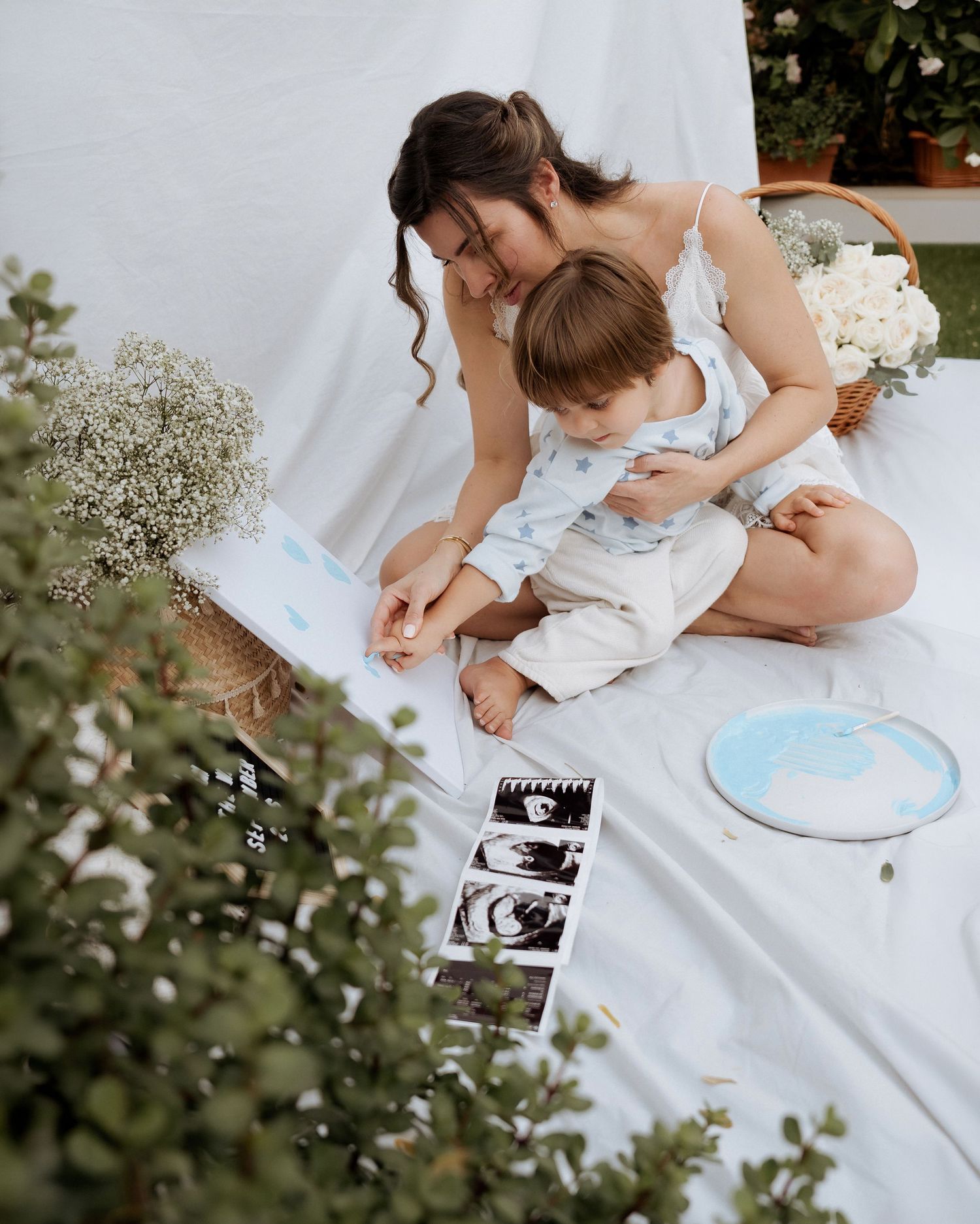 Candid motherhood moment during maternity photoshoot Dubai with mother and toddler outdoors