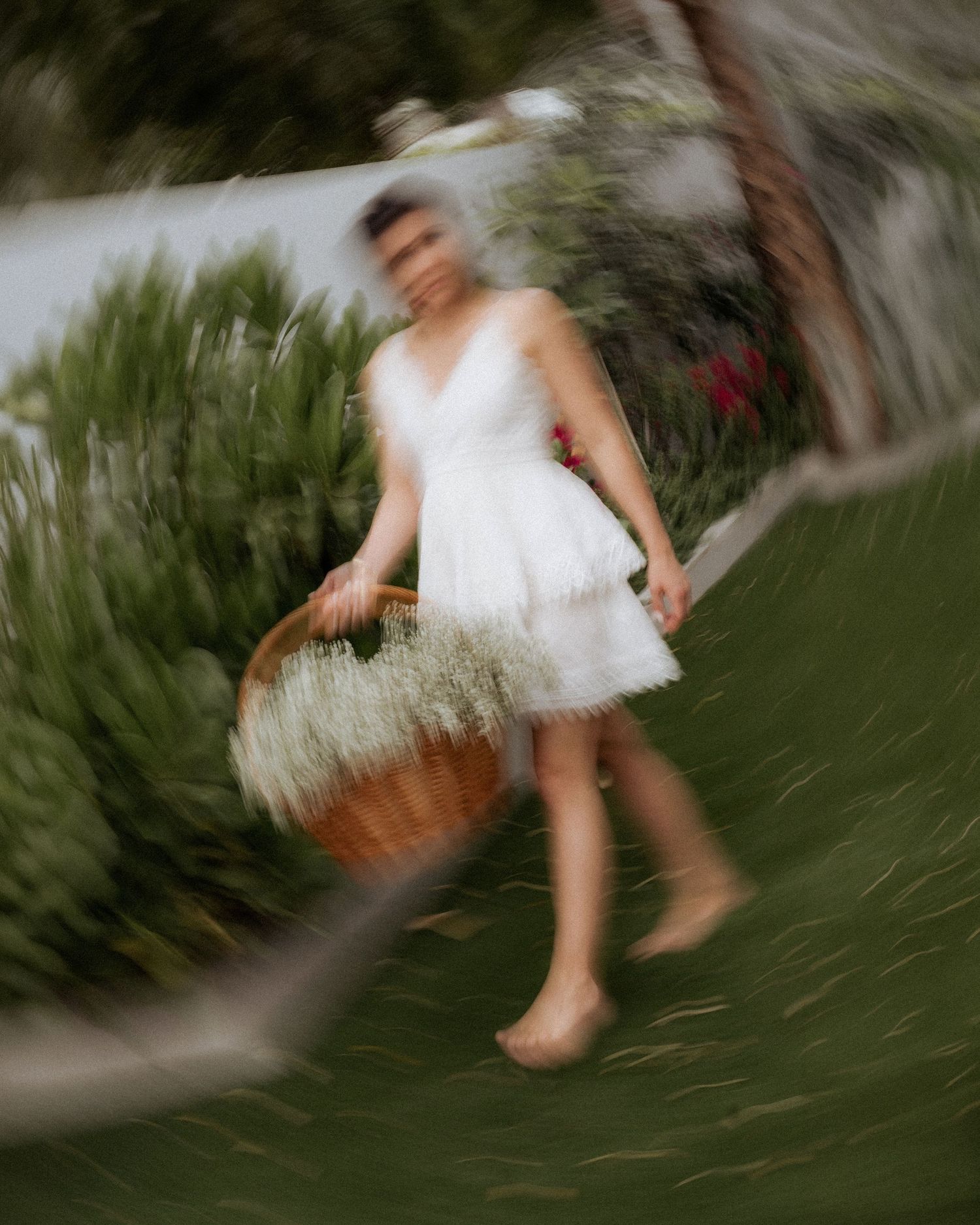 Lifestyle maternity photoshoot in Dubai with mother walking barefoot in natural garden