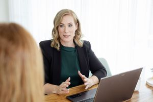 woman in formal attire talking to a client. content house branding photoshoot