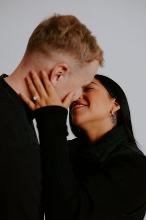 A candid moment of laughter and joy between a couple during their engagement photo session.