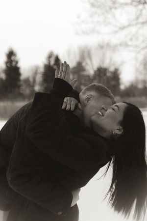 Sequential winter photography capturing tender moments between a couple in dark clothing.