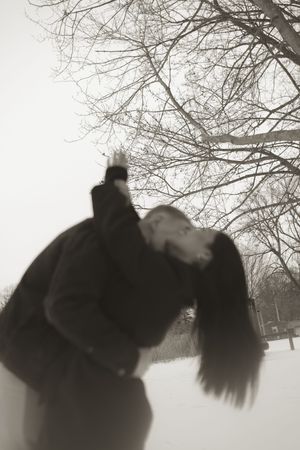 Dreamy black and white winter photos of two people sharing tender moments.