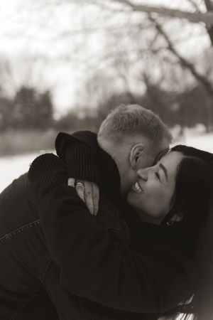 Winter love story captured in monochrome showing intimate moments between a couple.
