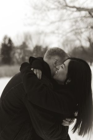 Sequential winter photography showing romantic moments between two people in dark clothing.