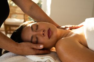 Professional massage therapy session in progress with soft natural lighting.