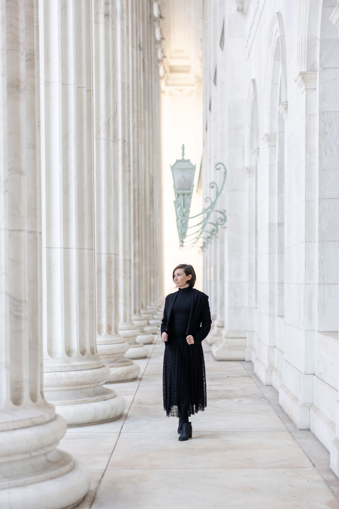 Colorado Springs Wedding Photographer with white columns and neutral background.