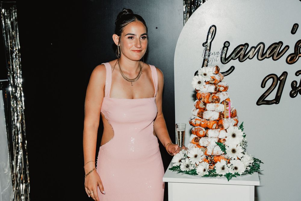A collage of pink bridesmaid dress photos with floral wedding cake details and rustic decor elements.