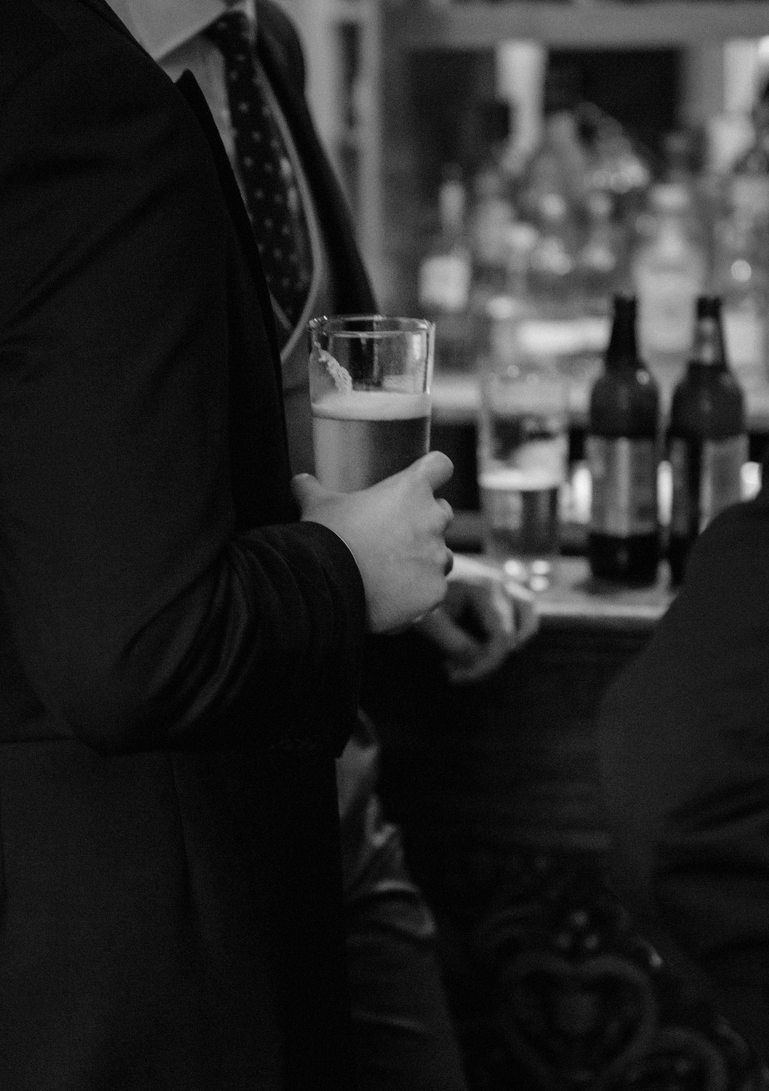 bar black and white drink beer candid preparation photography groomsmen