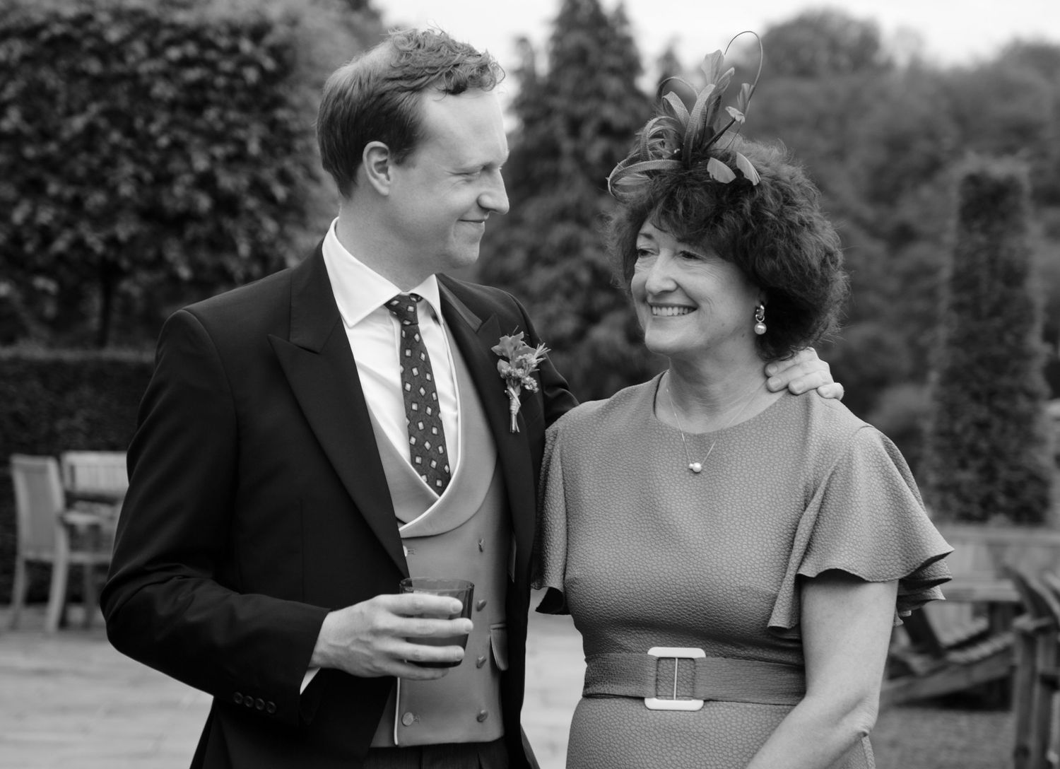 groom and mother of groom black and white candid moments emotional photography