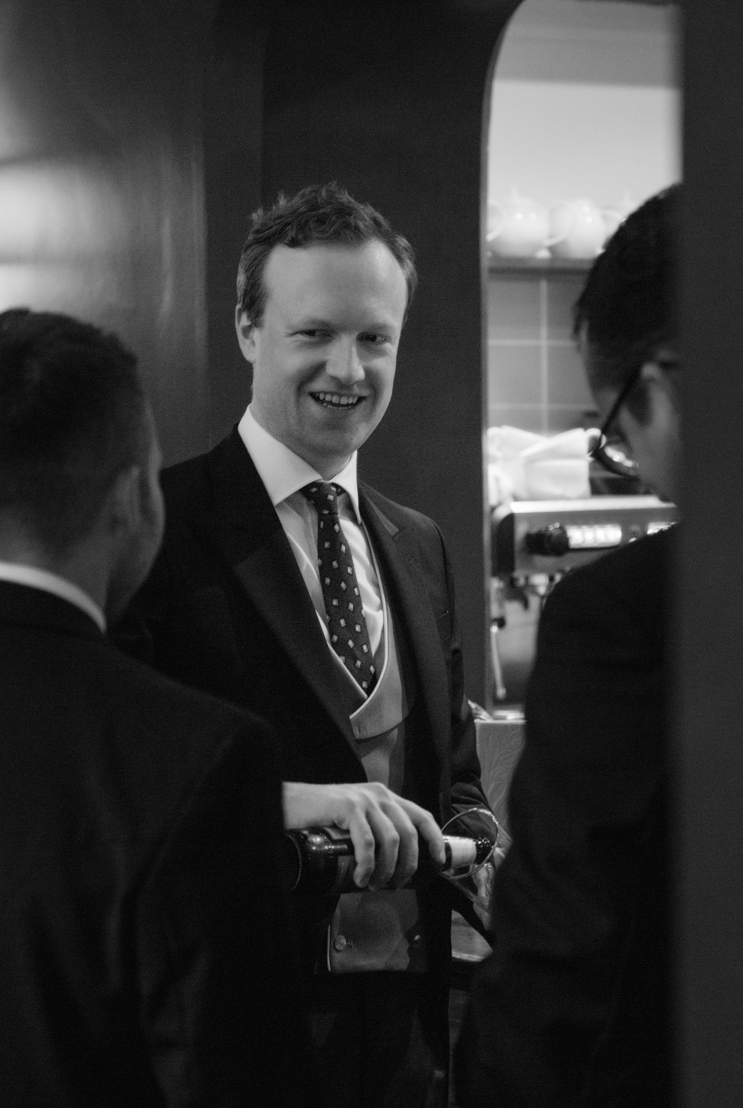 groom black and white portrait prep portraits happy candid photography