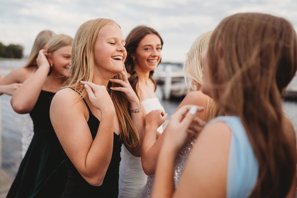 Close up of joyful friends sharing a candid moment outdoors.