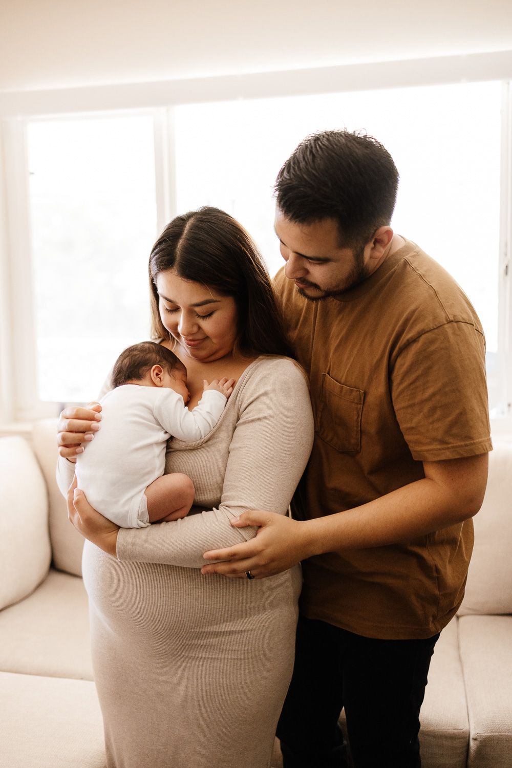 Mom holds baby at newborn photo session with Bay Area Newborn Photographer Cindy Tucey in Campbell