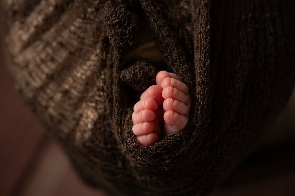 newborn baby feet photographed