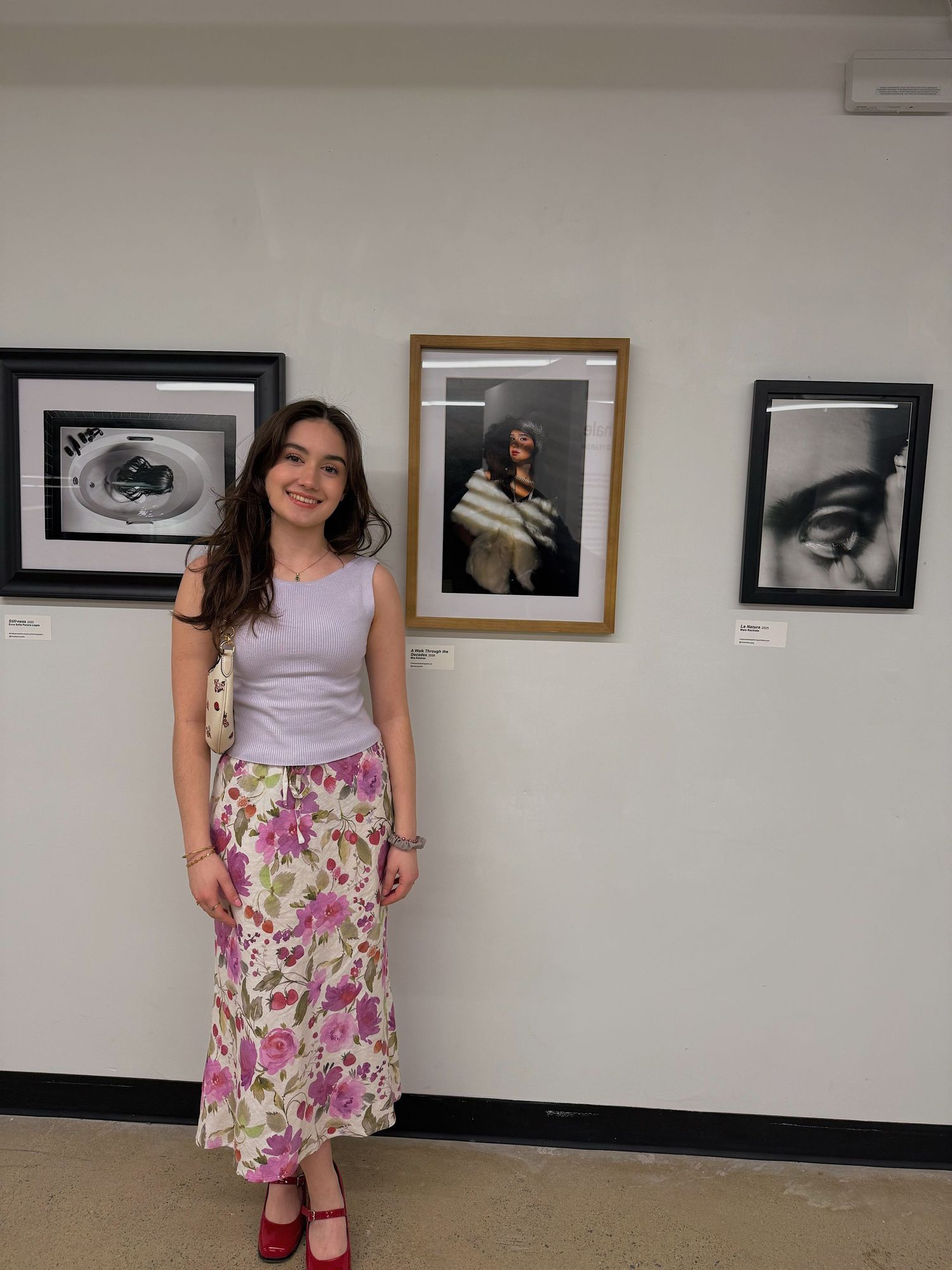 Inhale, Exhale, Third Year Show , 2026 photo of Mia Kolaras and hung up work ("The 1920's)