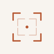 Minimalist camera focus icon with terracotta orange corner brackets and a small center dot on a cream background.