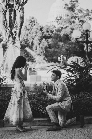 Photographer capturing the surprise proposal moment near Capitol Hill's hidden gem