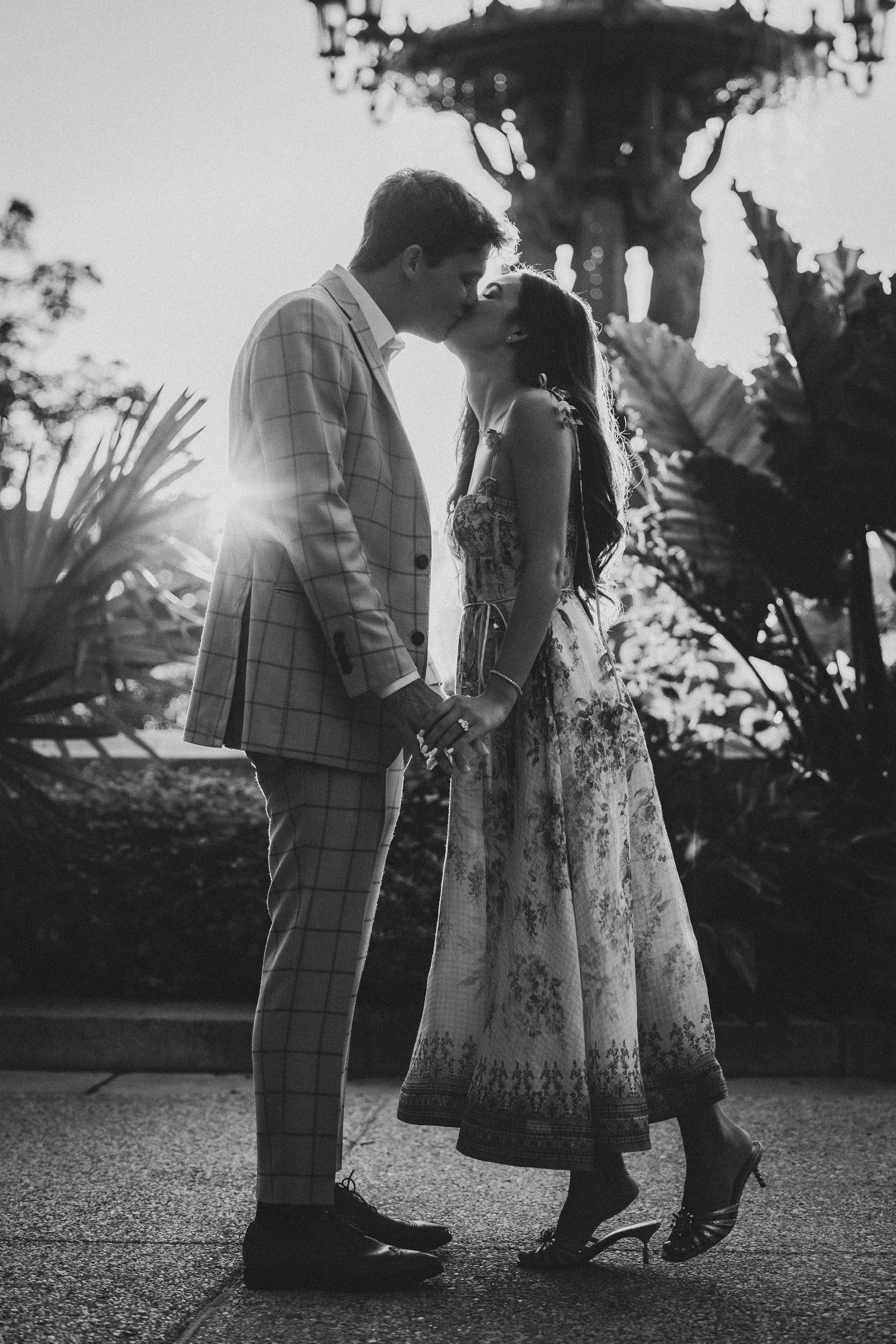 Golden hour lighting shining on the couple in front of ornate Bartholdi Fountain