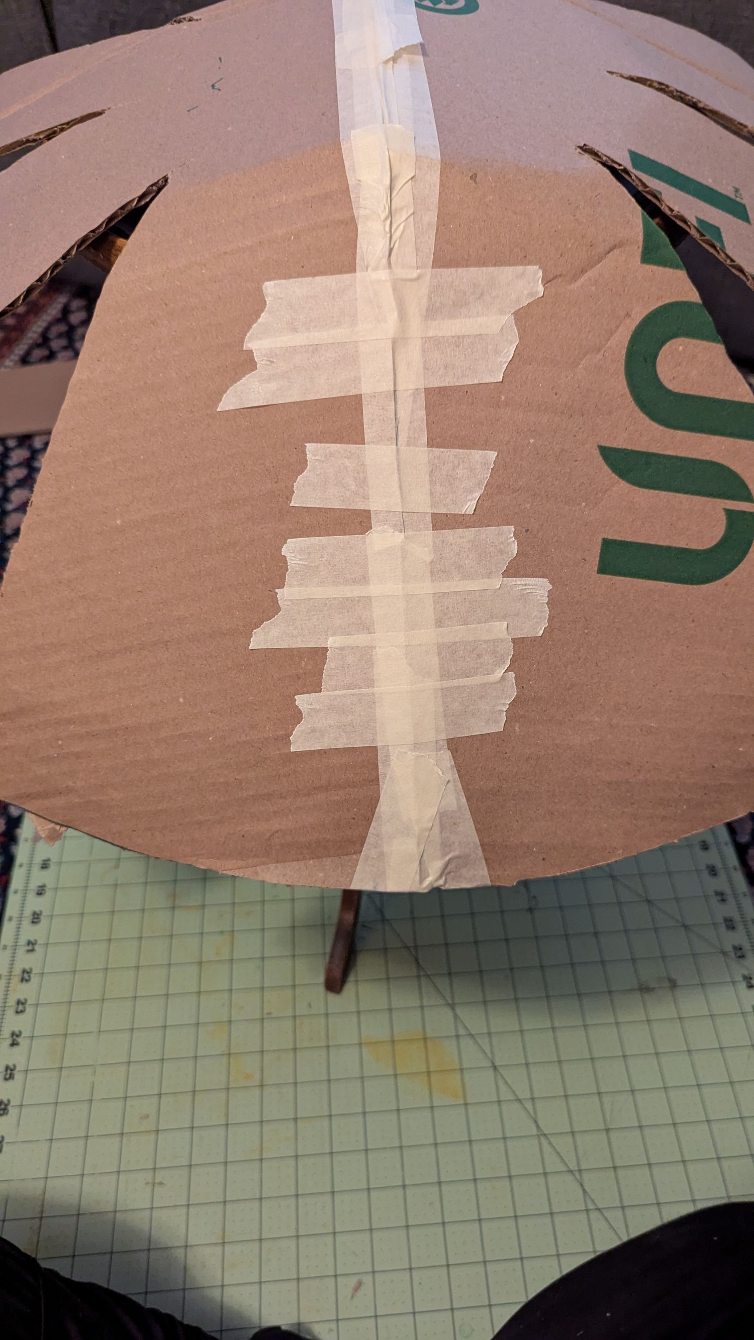 The Cardboard shape that becomes the mushroom top is being taped together.