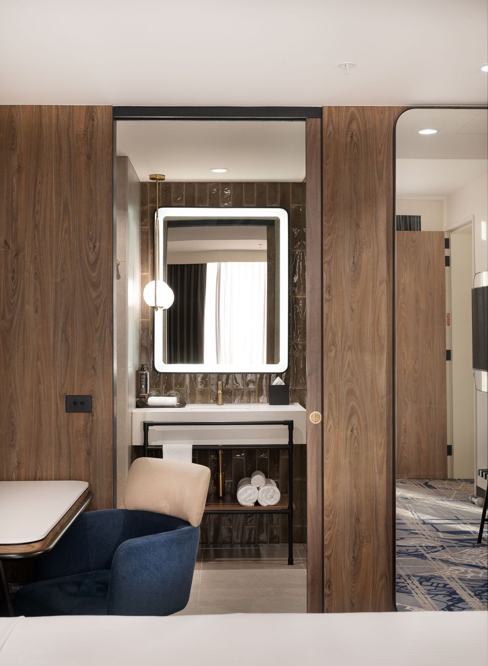 Interior photography highlighting premium finishes, textures and natural light within guest suites