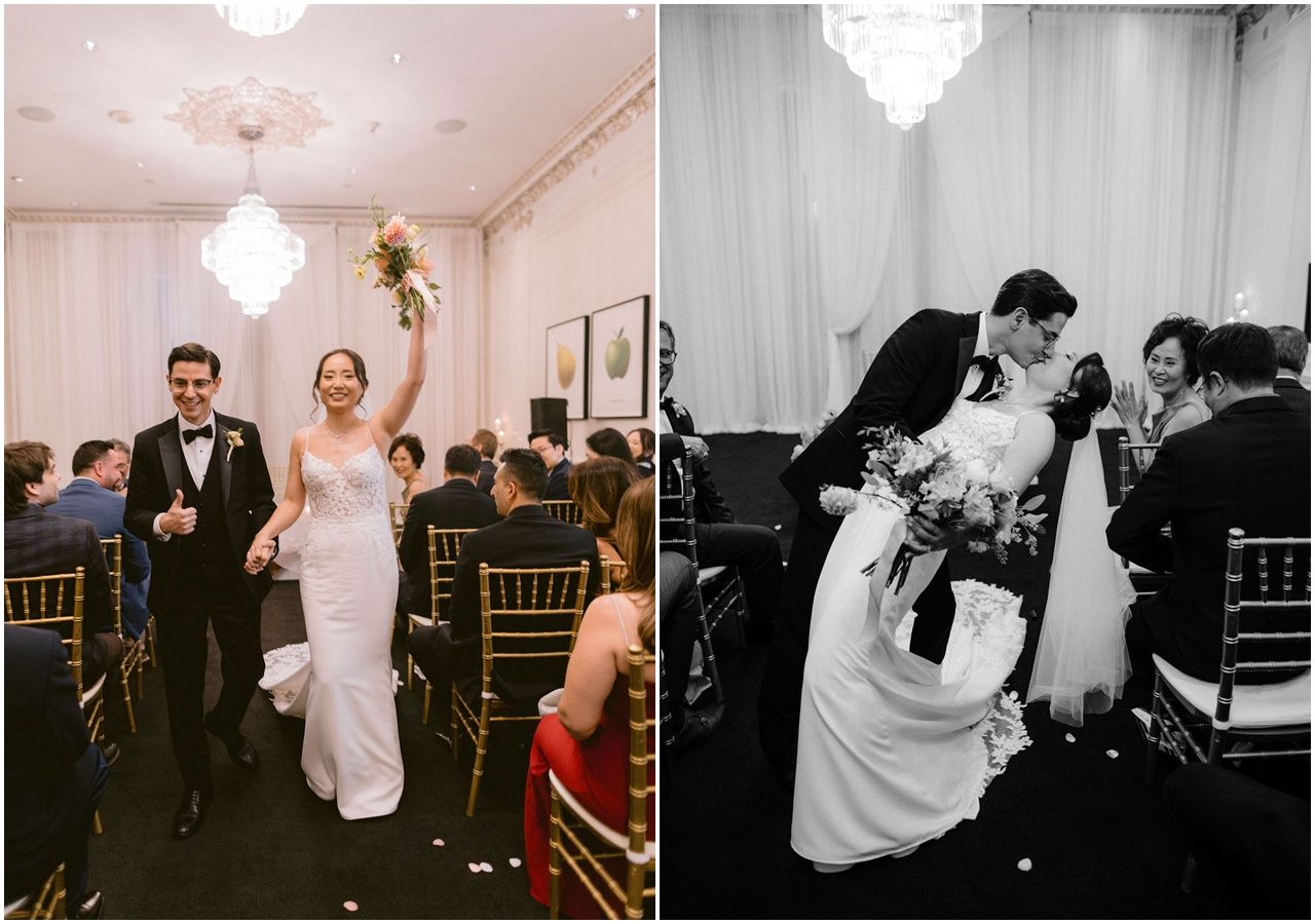 Wedding guests dance and celebrate on a dimly lit dance floor during an evening reception celebration.