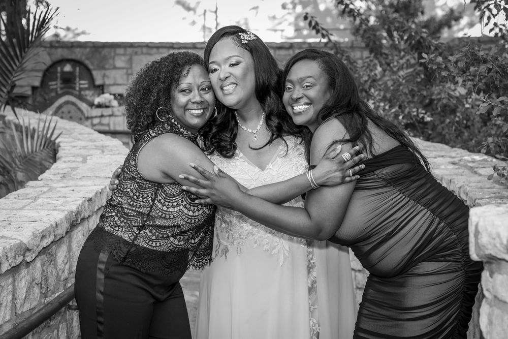 A group of people sharing joyful moments together in a series of black and white candid photographs.