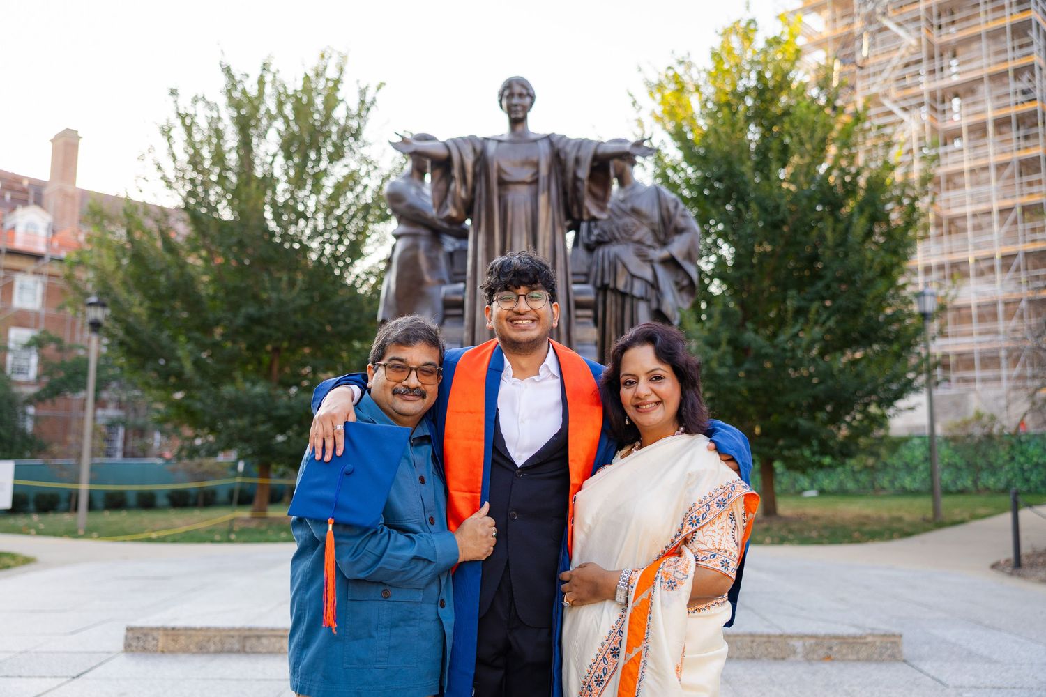 Family graduation photos in front of Alma Mater at the University of Illinois