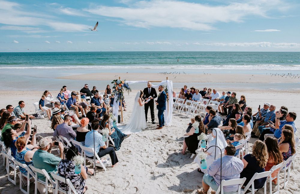 A series of beach wedding photos showing guests seated on white chairs along the shoreline with ocean waves in the background.