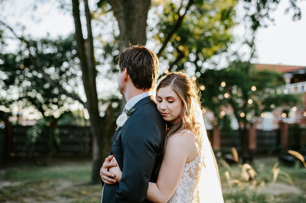 A series of wedding photos showing a couple sharing intimate moments under trees at sunset.