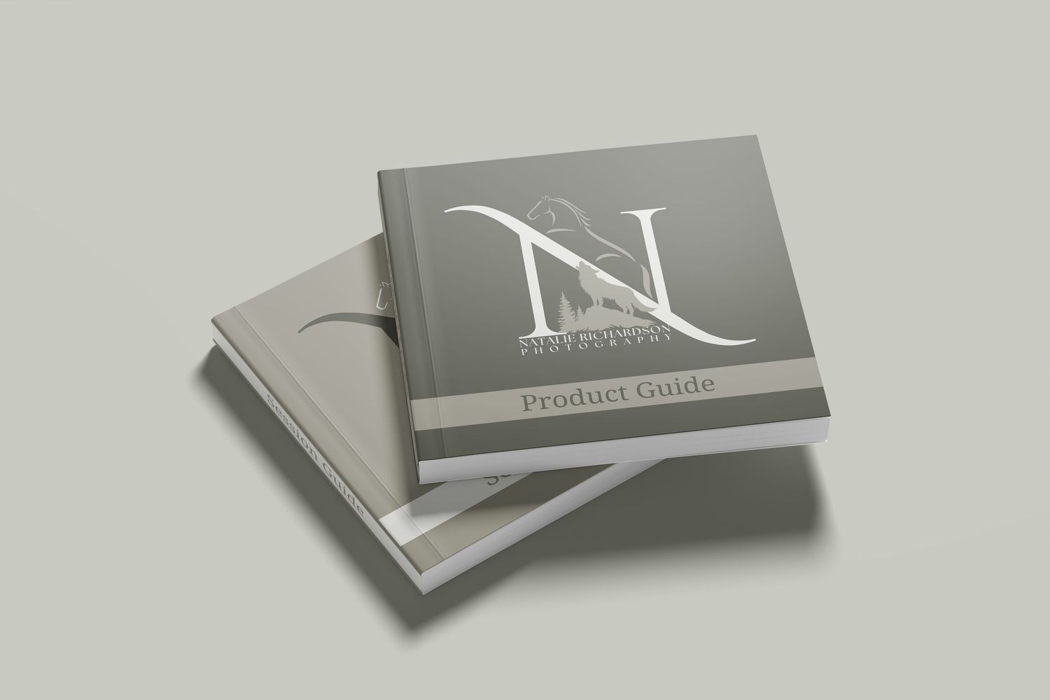 Stack of elegant gray business cards with metallic silver accents and minimalist design on light background.