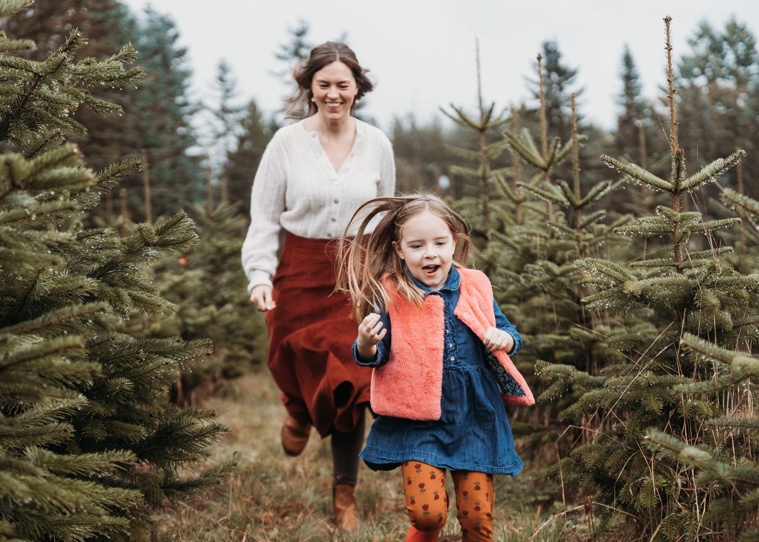 A series of candid moments captured at a Christmas tree farm showing joyful holiday interactions among visitors.