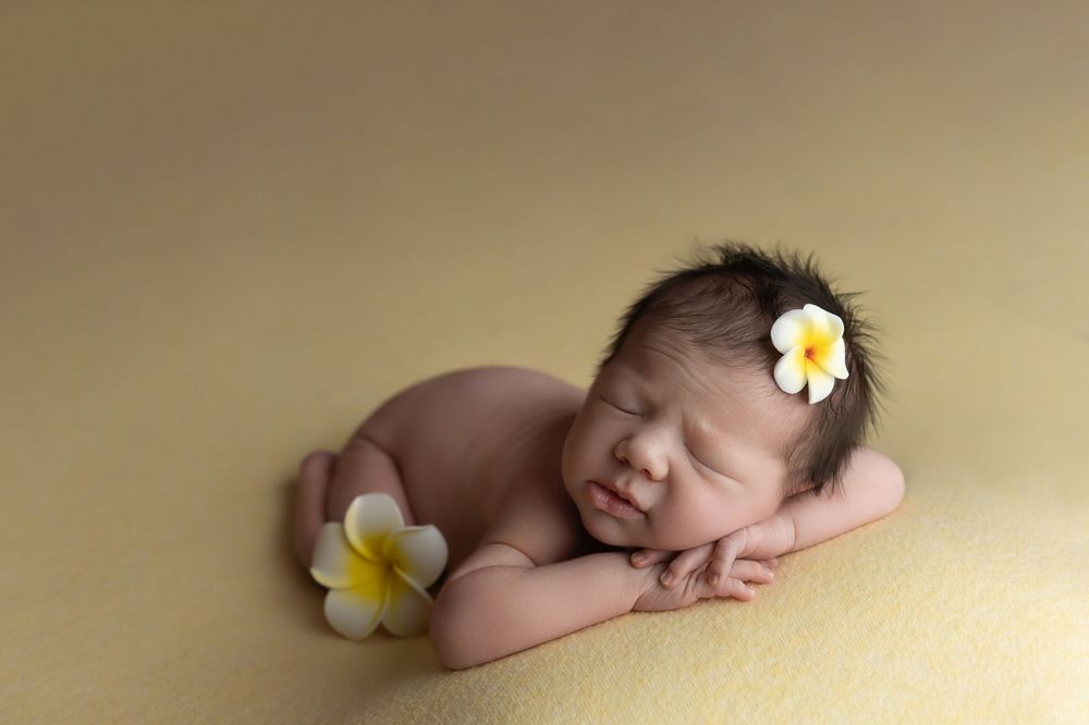 Newborn baby in yellow, taken by Jen Knightstep, Photographer