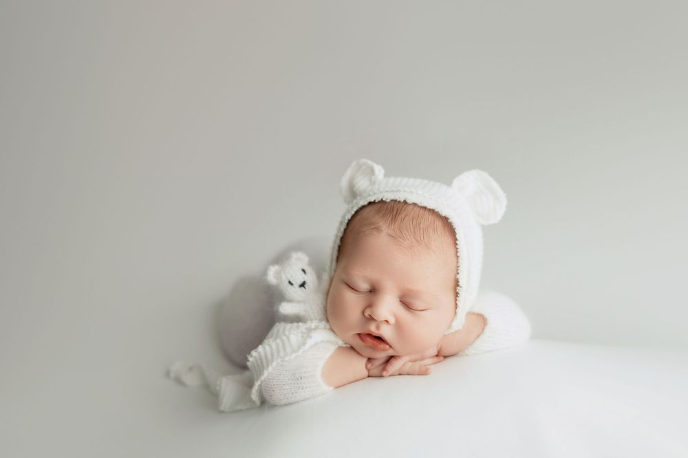 Newborn baby on white background, taken by Jen Knightstep, Photographer