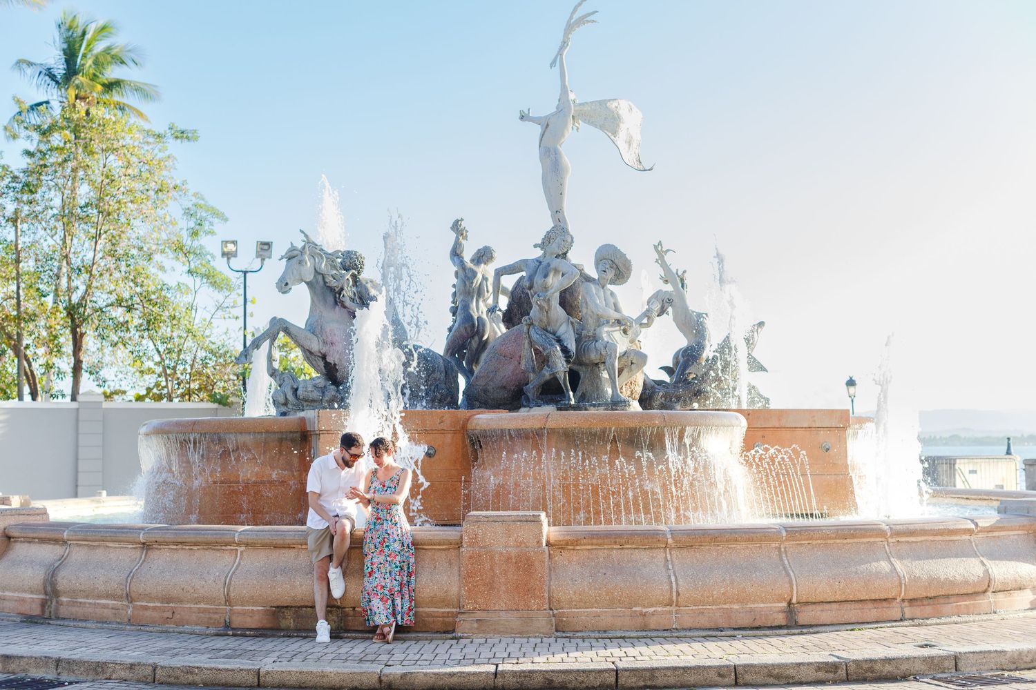 Couples portrait. Marriage proposal at Fuente Raíces in Old San Juan, Puerto Rico.