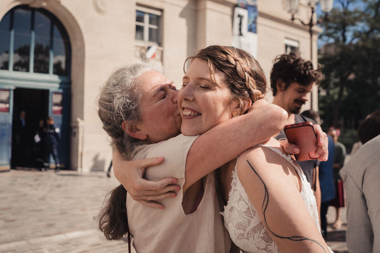 A series of romantic wedding photos showing tender moments between a couple in an outdoor setting.