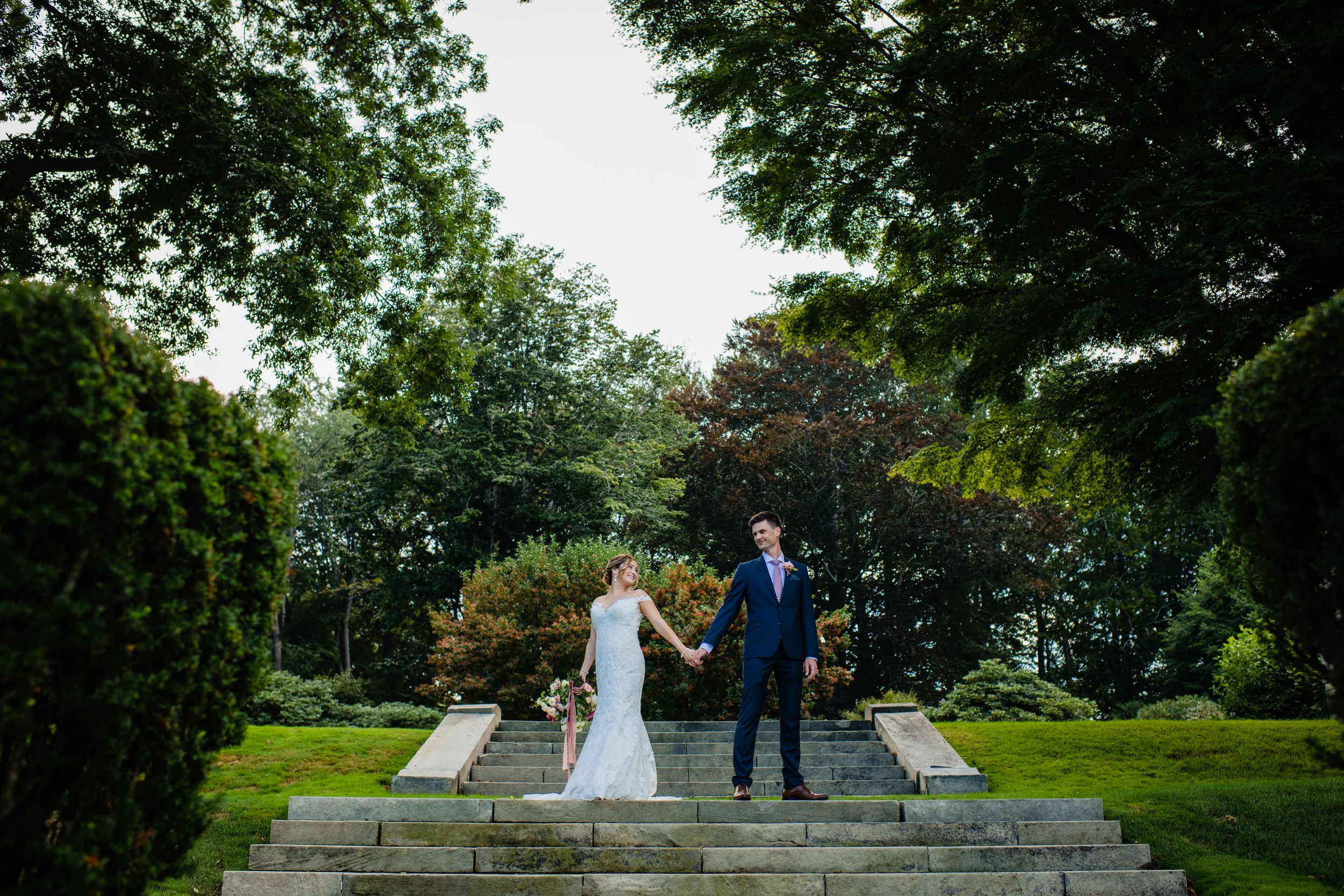 Romantic garden wedding at Glen Manor House. Waterfront estate photography in Portsmouth, RI capturing authentic moments by Stefy Hilmer.