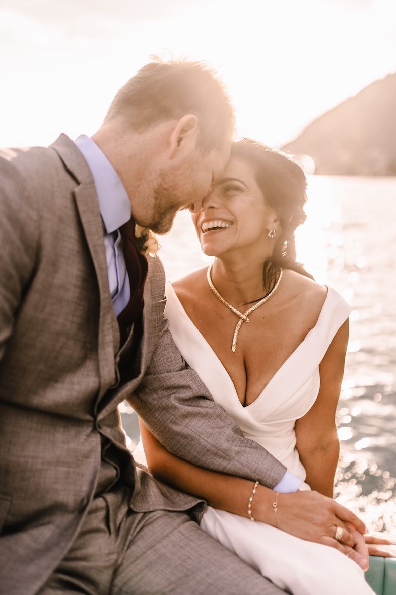Sunset Riva boat ride on Lake Iseo for bride and groom wedding photos