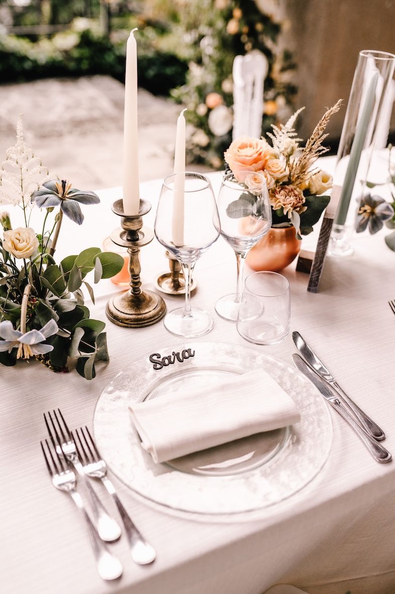 Details of long wedding dinner table overlooking Lake Iseo